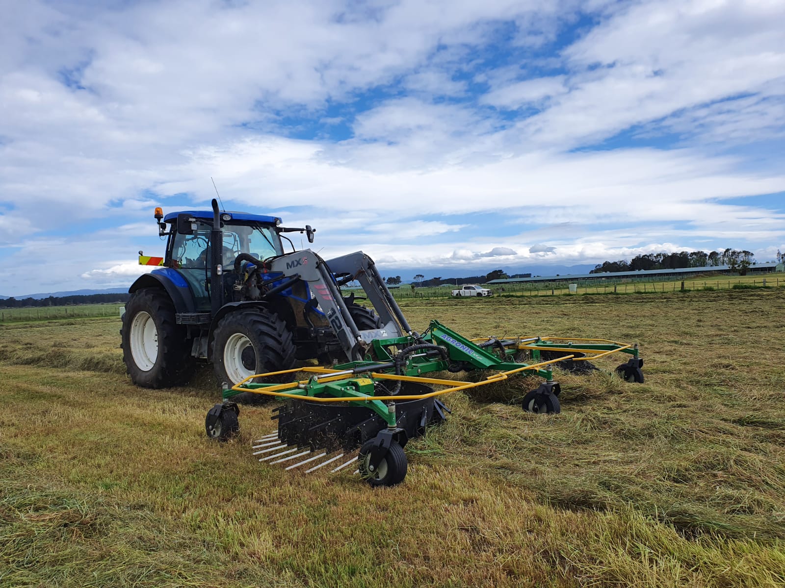 Front mounted rake for tractor